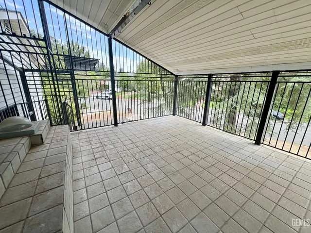 a view of outdoor space with wooden floor