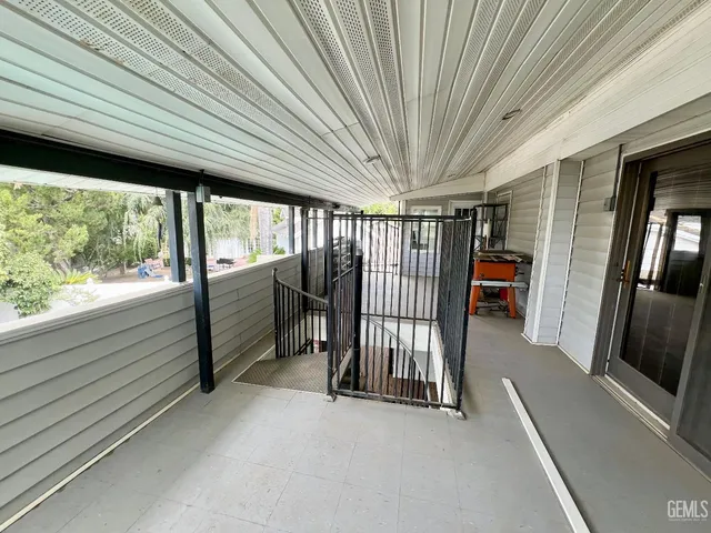 a view of a swimming pool with a lounge chairs
