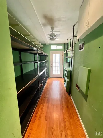 a view of balcony with wooden floor