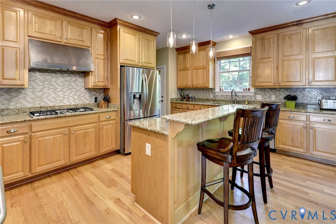 4015 Cold Spring Road Williamsburg, VA 23188 - Photo 19 of 57 Kitchen featuring light wood cabinetry, natural st