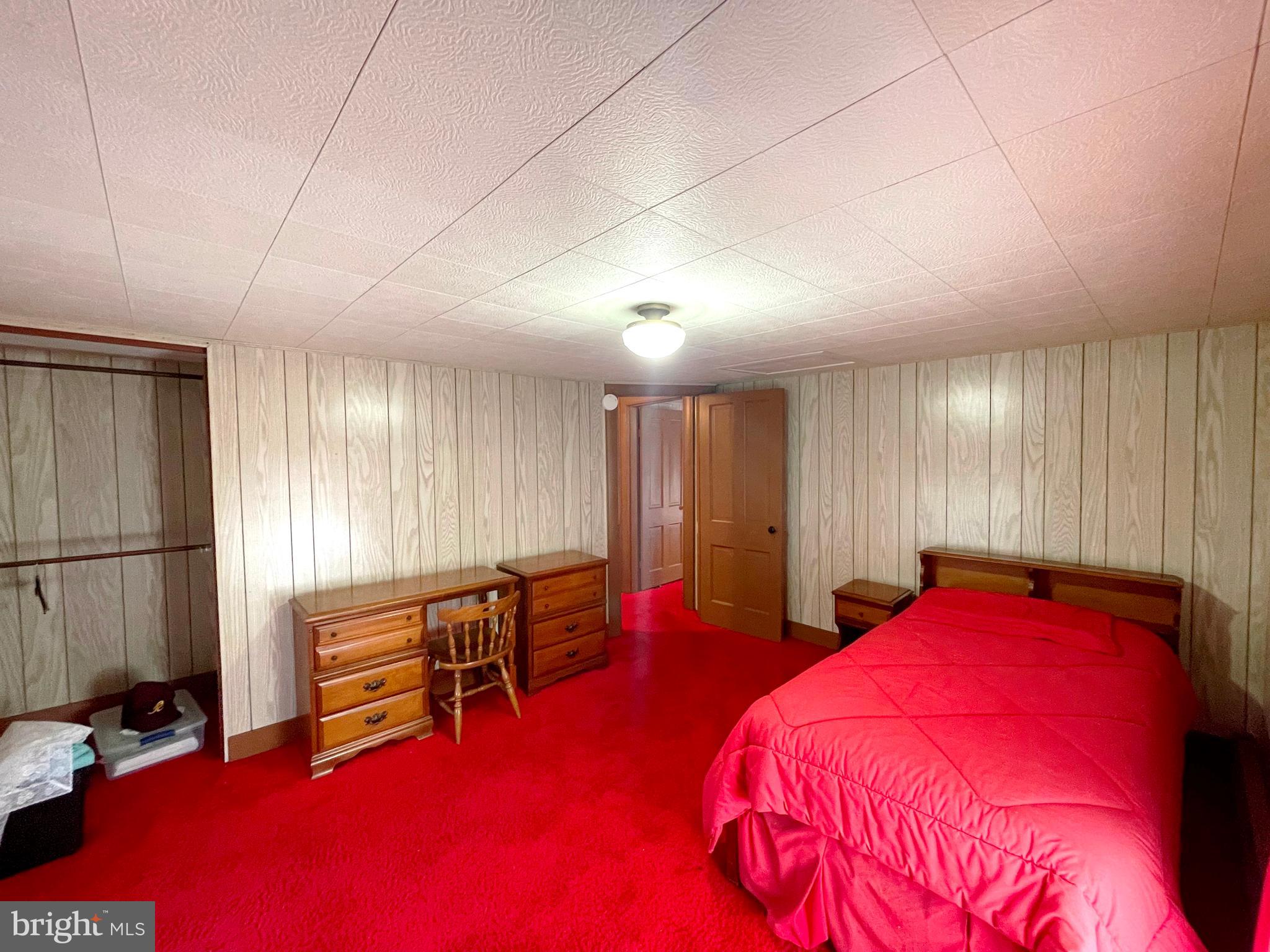 6700 Hungerford Road Bryans Road, MD 20616 - Photo 25 of 36 a bed room with a bed and a chair