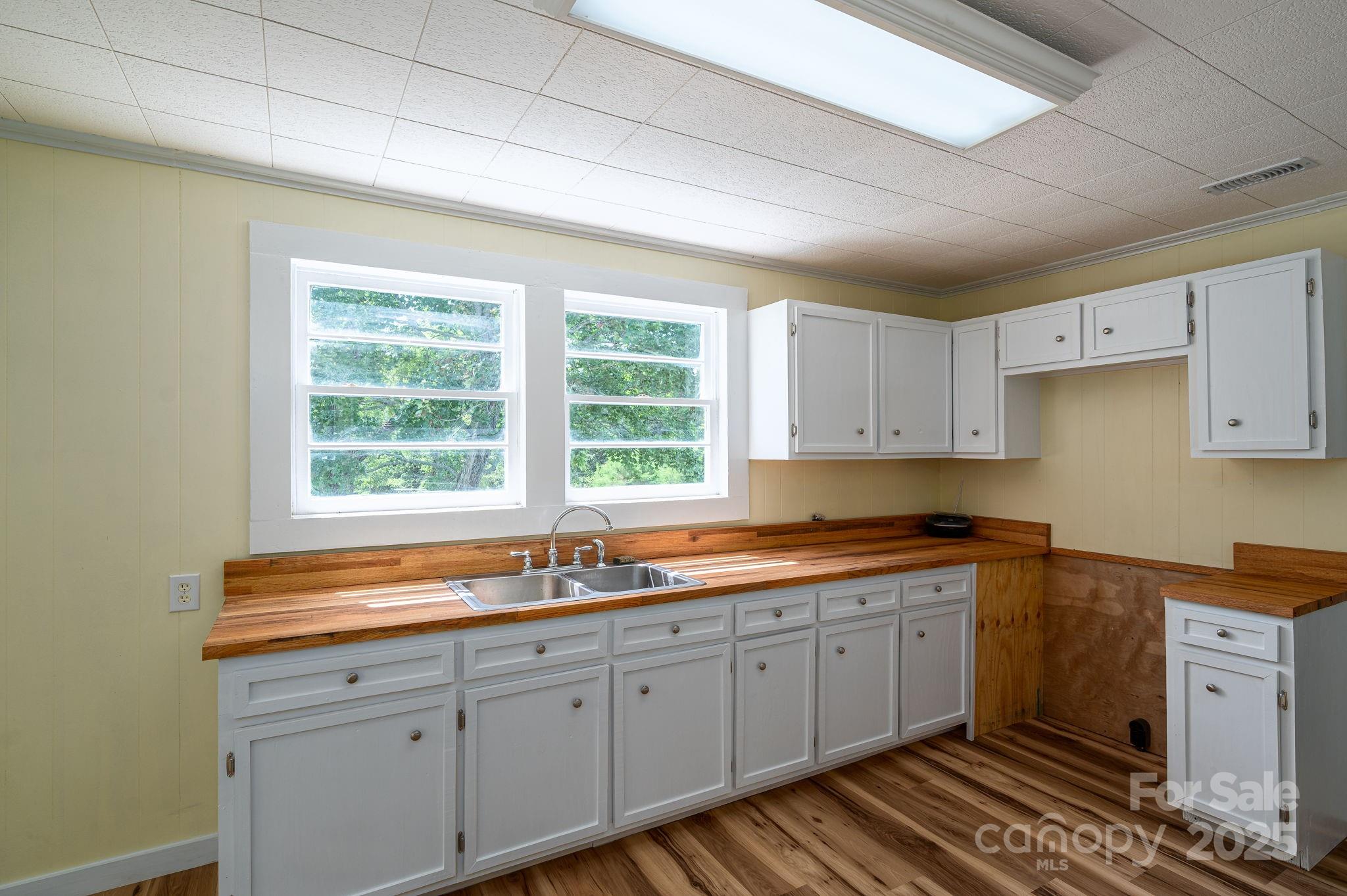 5746 Casar Road Casar, NC 28020 - Photo 10 of 24 a kitchen with sink a window and cabinets