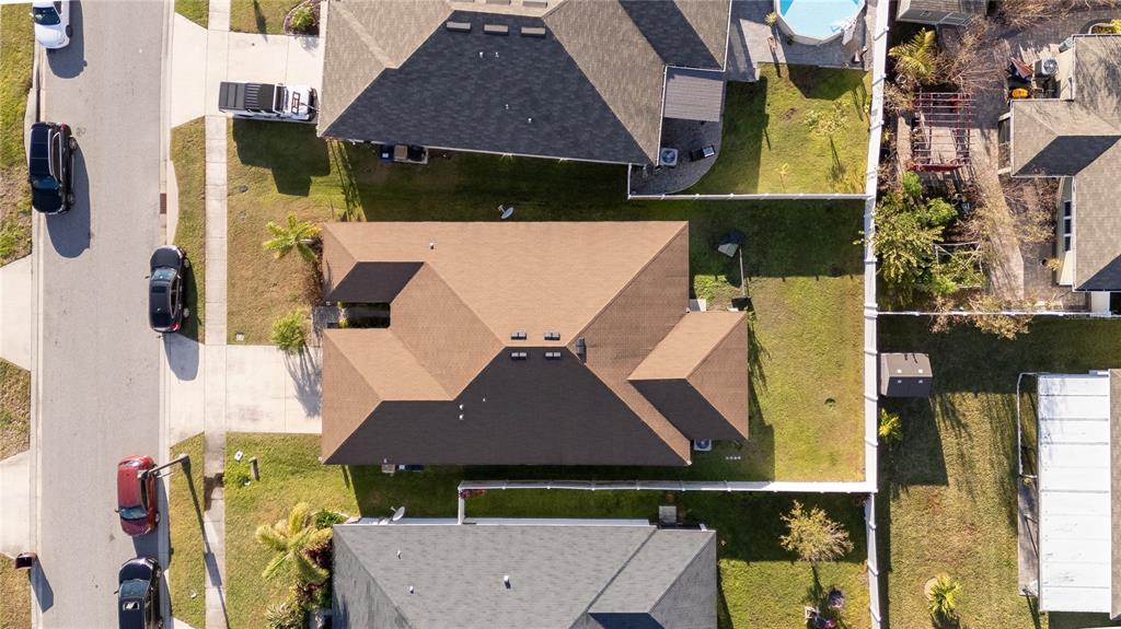 4563 Orchard Grove Road St. Cloud, FL 34772 - Photo 4 of 51 an aerial view of multiple houses with a yard