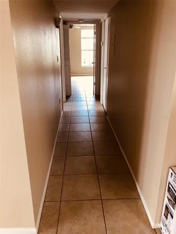 a view of hallway with windows