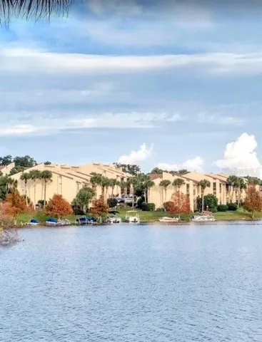a view of yard with ocean and trees