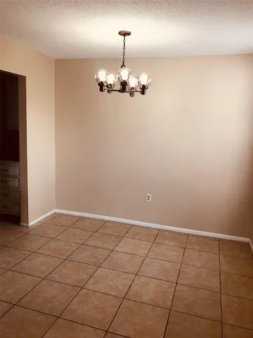 a view of kitchen with granite countertop cabinets
