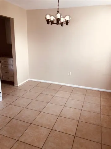 a view of a livingroom with an empty space and a sink