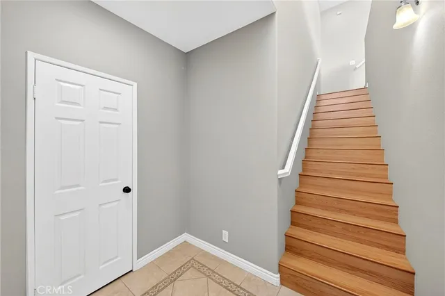a view of a hallway with wooden floor and entryway