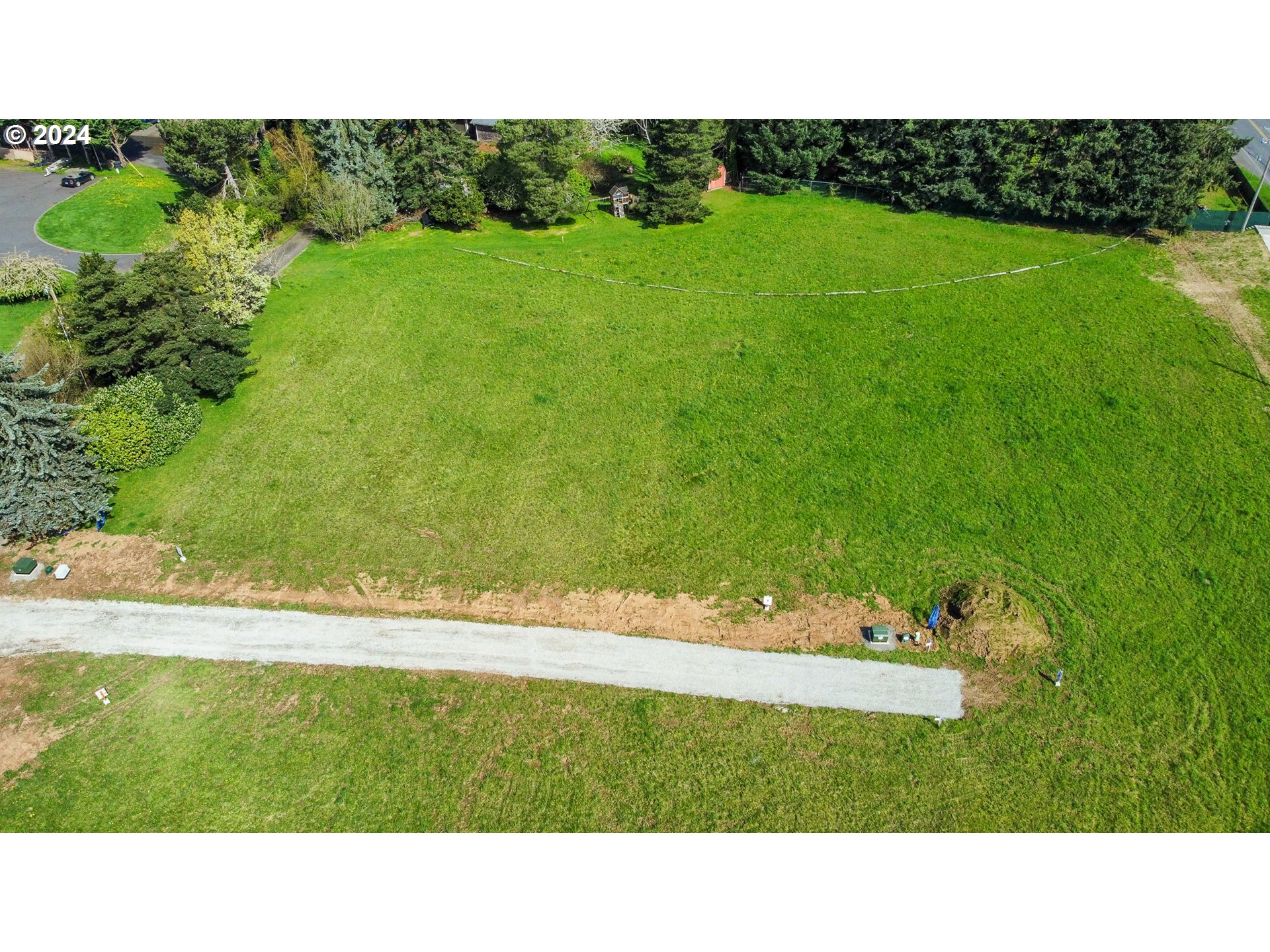15622 Northeast Caples Road, Unit 3 Brush Prairie, WA 98606 - Photo 5 of 14 a open area with grassy field and trees