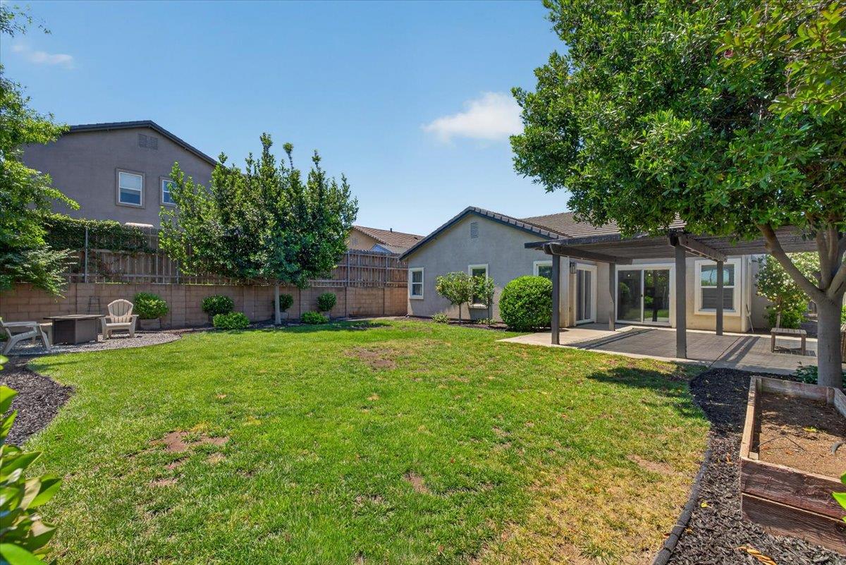437 Silver Ridge Court Oakdale, CA 95361 - Photo 32 of 41 a front view of house with a garden and patio