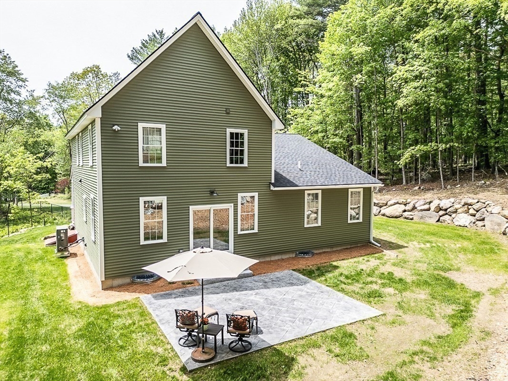531 Clark Street Gardner, MA 01440 - Photo 2 of 42 a backyard of a house with table and chairs