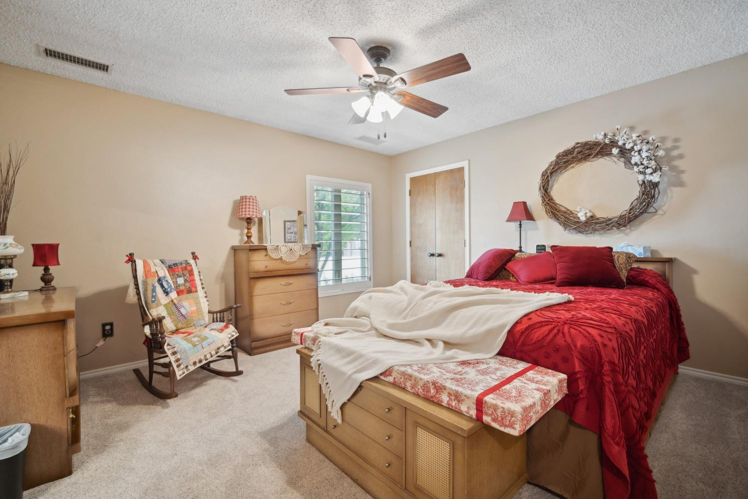 9002 Woodrow Road Wolfforth, TX 79382 - Photo 18 of 48 a bed room with a bed and a chair