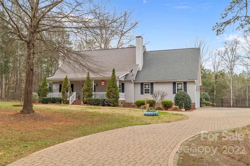 1574 Dirt Road Lancaster, SC 29720 - Photo 1 of 36 a front view of a house with a yard and garage