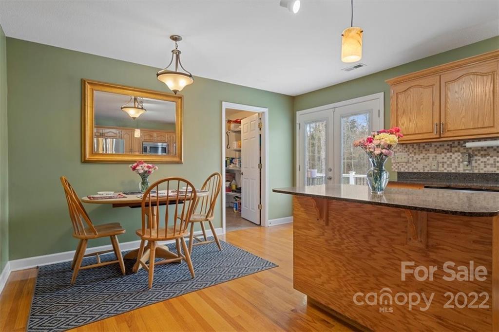 1574 Dirt Road Lancaster, SC 29720 - Photo 12 of 36 a view of a dining room with furniture window and wooden floor