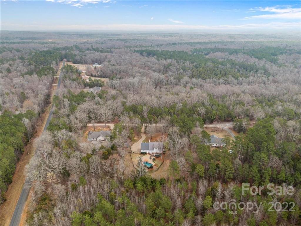 1574 Dirt Road Lancaster, SC 29720 - Photo 31 of 36 an aerial view of residential building with green space and fog