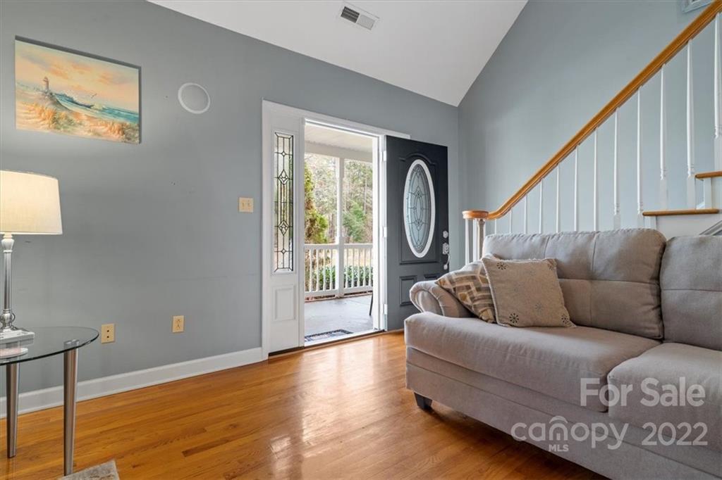 1574 Dirt Road Lancaster, SC 29720 - Photo 5 of 36 a living room with couches and a large window with wooden floor