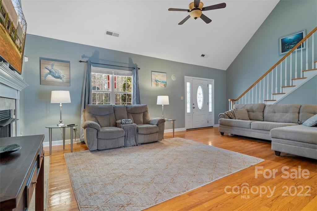 1574 Dirt Road Lancaster, SC 29720 - Photo 6 of 36 a living room with furniture and a wooden floor
