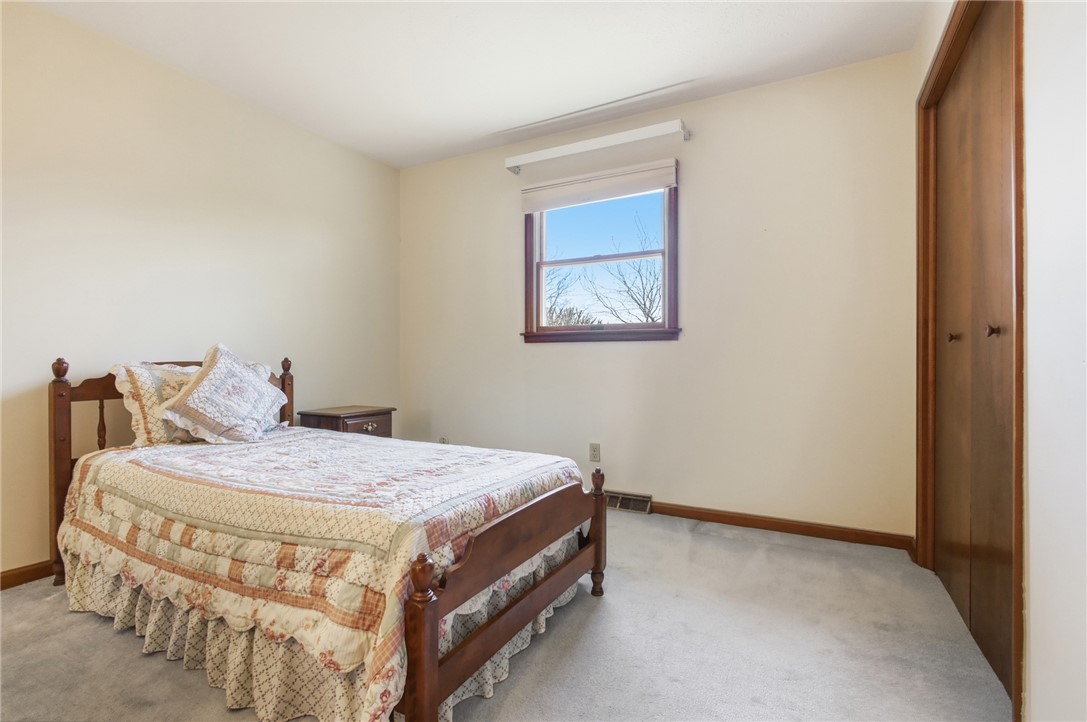 6718 Old Columbus Road South Vienna, OH 45369 - Photo 26 of 33 This cozy bedroom offers a tranquil retreat with soft lighting and comfortable carpeting.