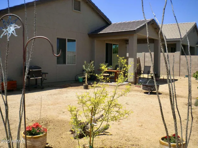 a view of a house with a snow in the yard