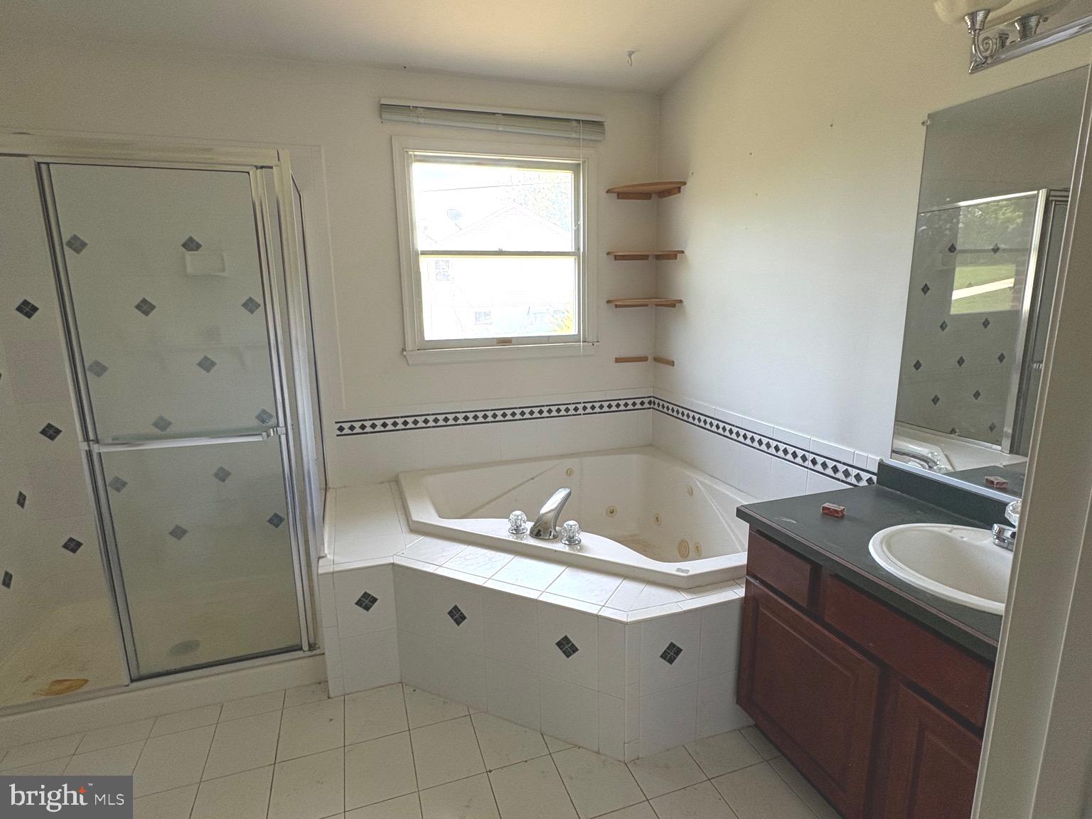 4215 Buffalo Road Mount Airy, MD 21771 - Photo 5 of 44 a spacious bathroom with a granite countertop sink mirror and shower