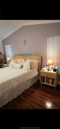 a living room with furniture and a lamp