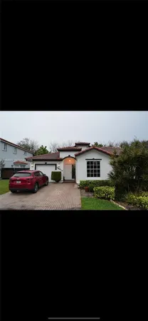 a view of a big yard with an outdoor seating