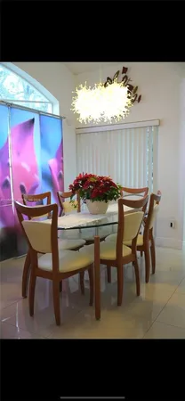 a kitchen with a refrigerator and cabinets