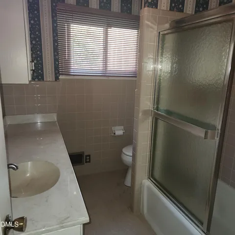 a bathroom with a toilet and a sink