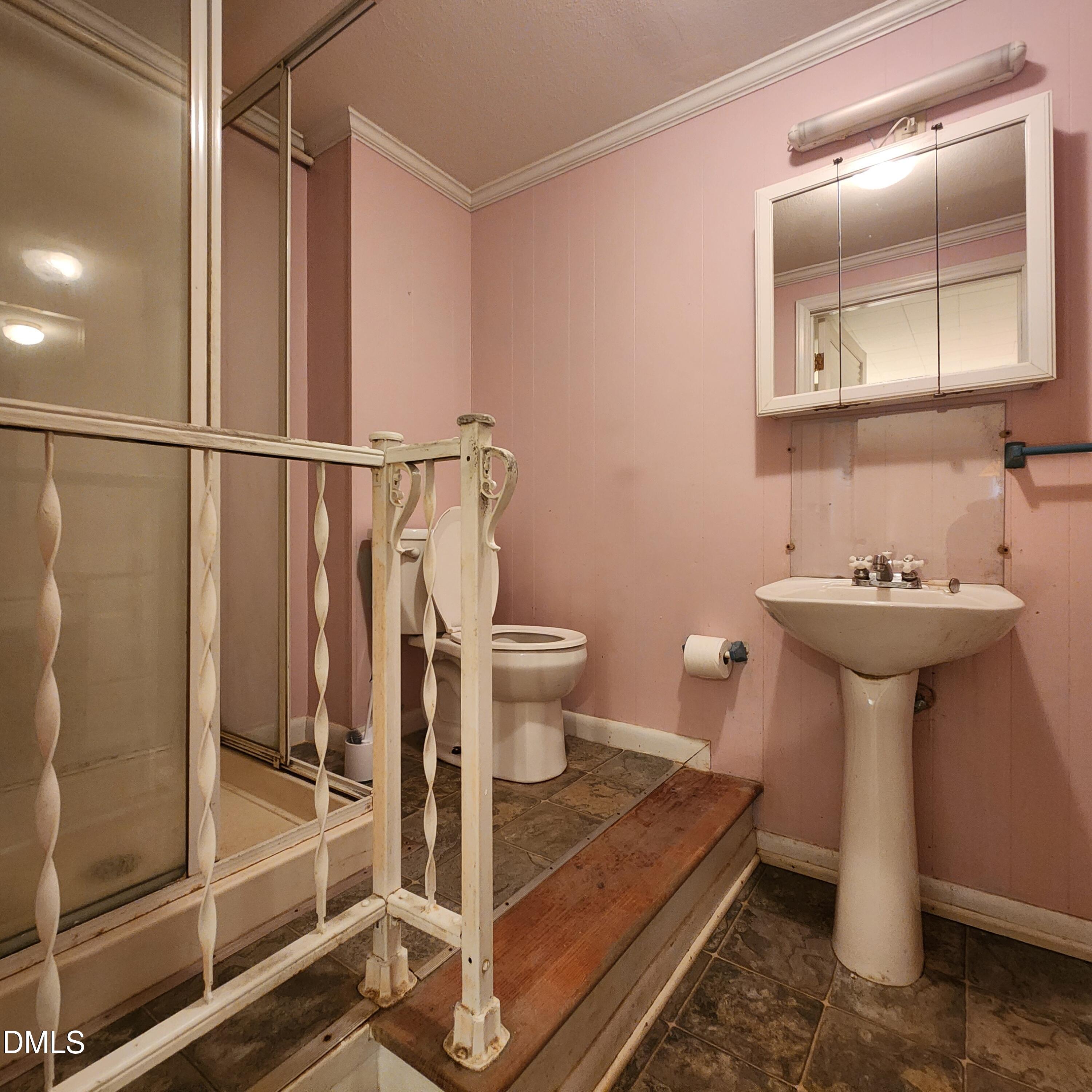 744 Durham Road Wake Forest, NC 27587 - Photo 23 of 25 a bathroom with a sink toilet and shower