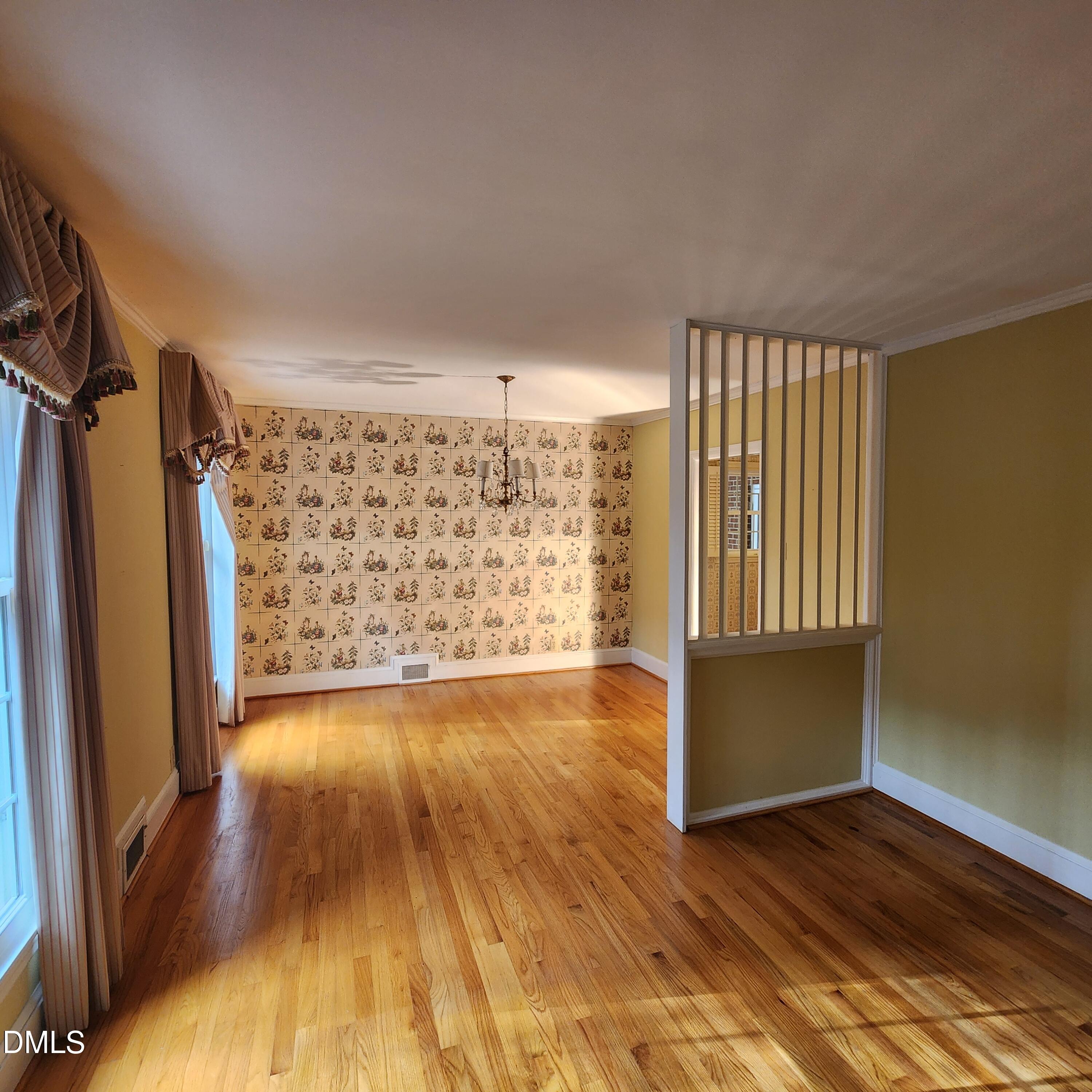 744 Durham Road Wake Forest, NC 27587 - Photo 7 of 25 a view of empty room with wooden floor and fan