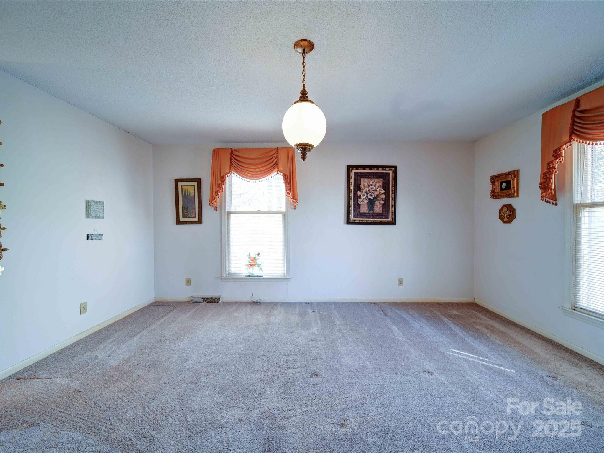1120 Jug Broome Road Monroe, NC 28112 - Photo 22 of 33 wooden floor in an empty room with a window