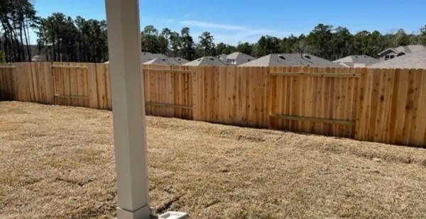 a view of a backyard of the house