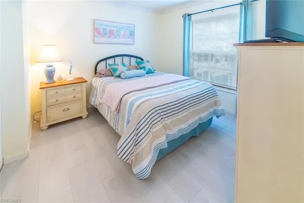 a bedroom with a bed and a cabinets