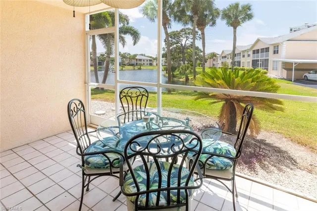 a view of a swimming pool with a lounge chair