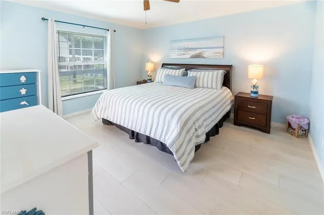 a bedroom with a bed and window