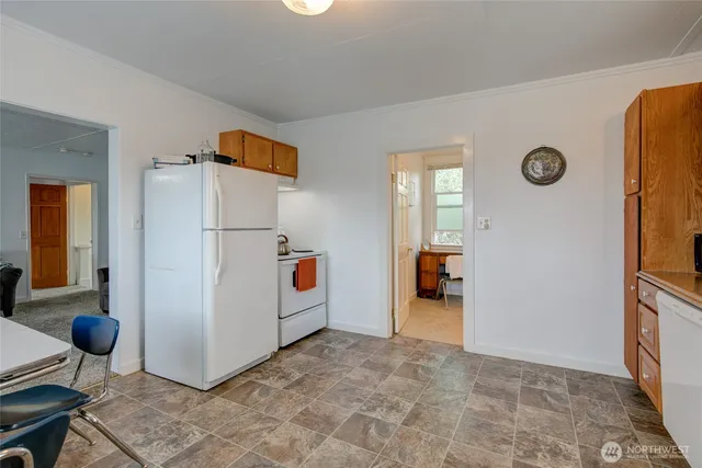 a view of a storage & utility room with two washing machine