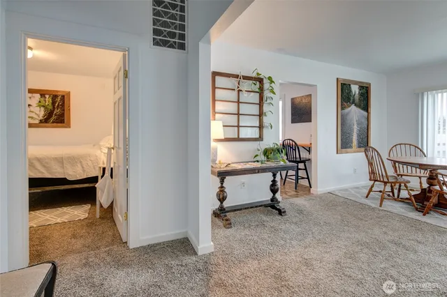 a view of a livingroom with furniture and windows