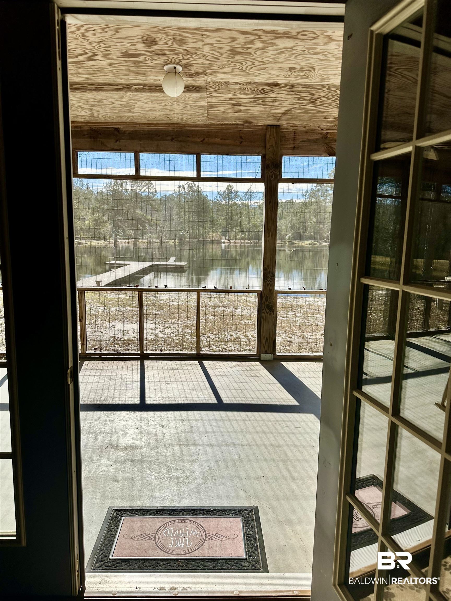 3881 Old Atmore Road Flomaton, AL 36441 - Photo 12 of 22 Doorway with a water view and wood ceiling
