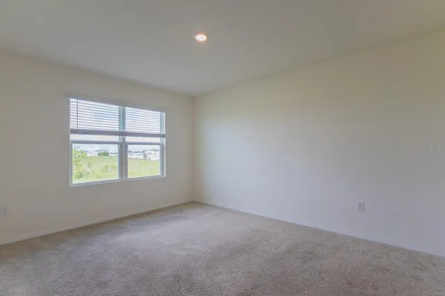 a bathroom with a granite countertop toilet a sink and a shower