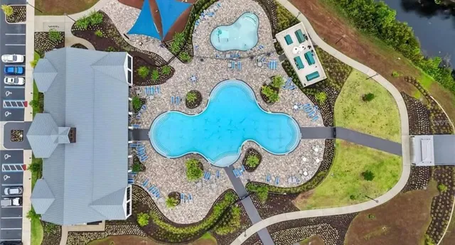 a view of a swimming pool with a lake view