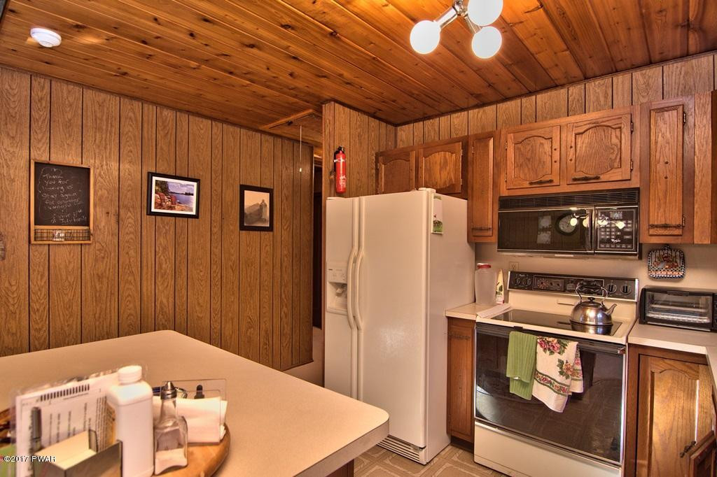 2320 Brookfield Road Lake Ariel, PA 18436 - Photo 10 of 45 a kitchen with stainless steel appliances granite countertop a refrigerator and a stove