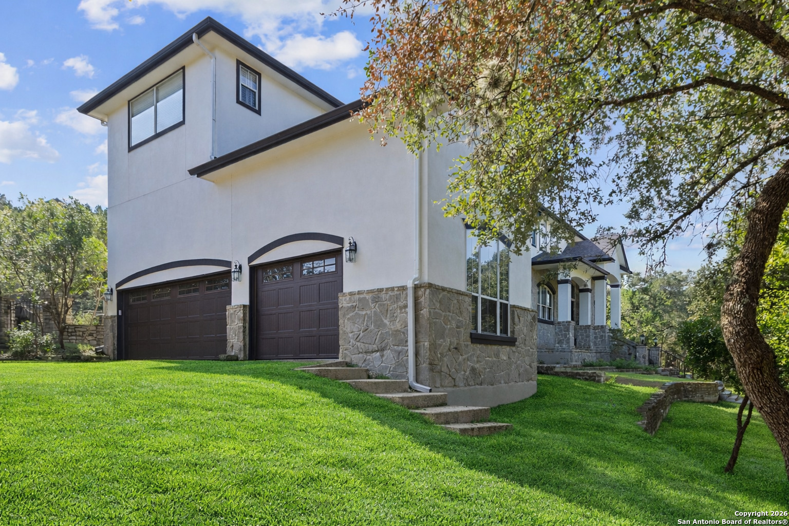 10924 Reyes Canyons Helotes, TX 78023 - Photo 14 of 61 a front view of a house with garden