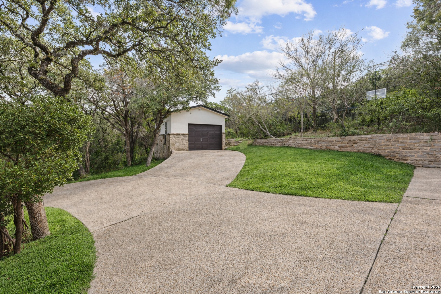 10924 Reyes Canyons Helotes, TX 78023 - Photo 15 of 61 a view of a house with a yard and large tree