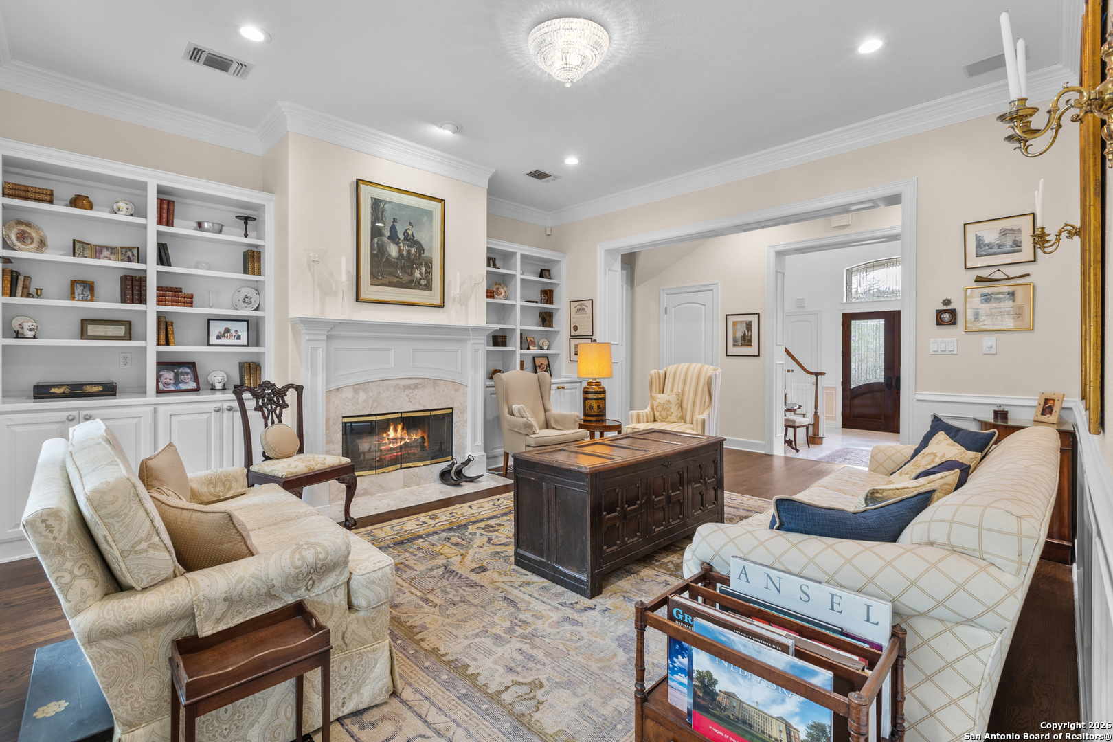 10924 Reyes Canyons Helotes, TX 78023 - Photo 19 of 61 a living room with furniture a fireplace and a flat screen tv