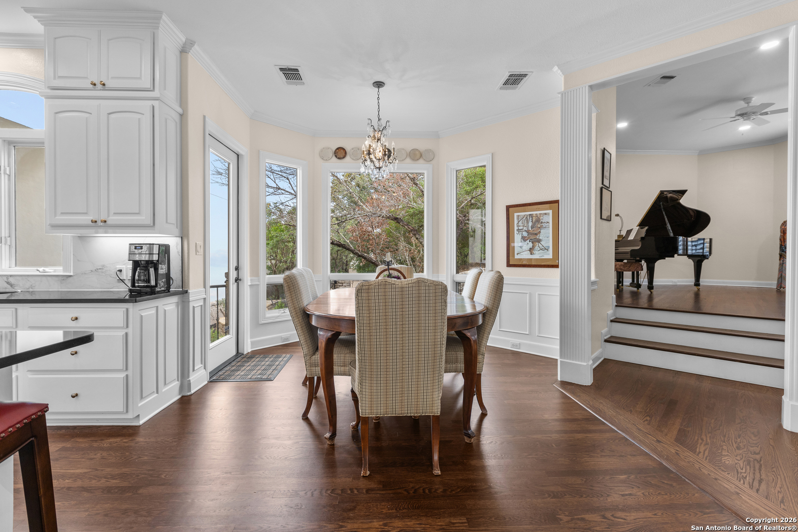 10924 Reyes Canyons Helotes, TX 78023 - Photo 27 of 61 a view of a dining room with furniture window and wooden floor