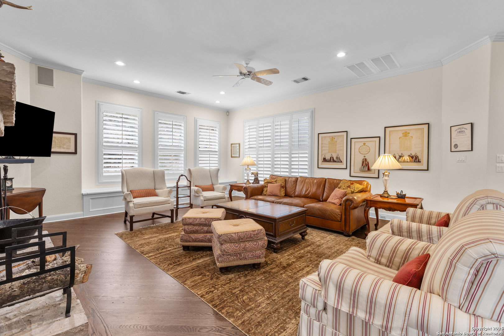 10924 Reyes Canyons Helotes, TX 78023 - Photo 29 of 61 a living room with furniture a large window and a flat screen tv