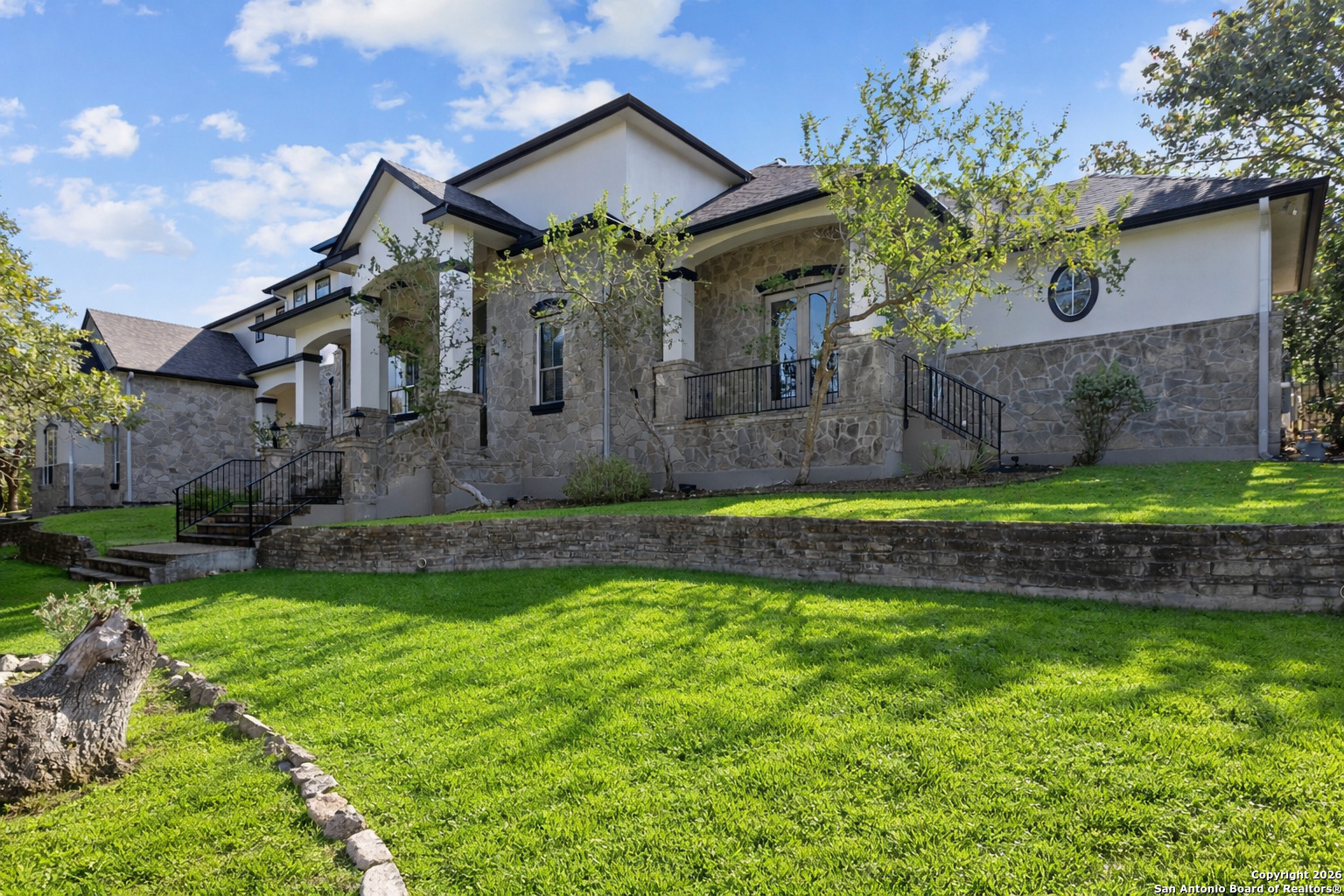10924 Reyes Canyons Helotes, TX 78023 - Photo 3 of 61 a front view of a house with a yard