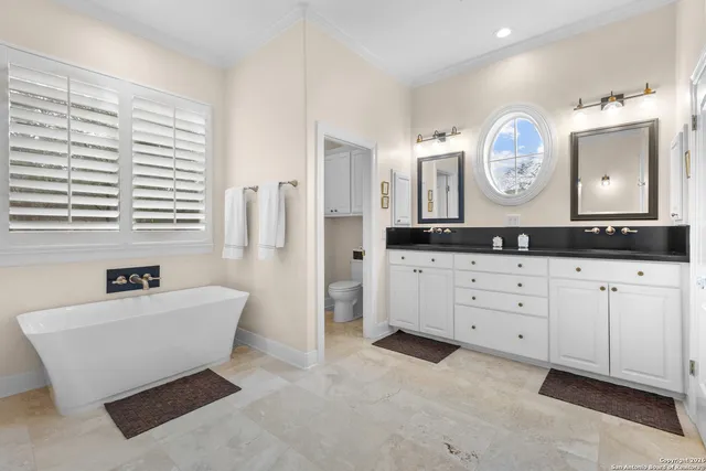a view of a workspace with furniture and a potted plant