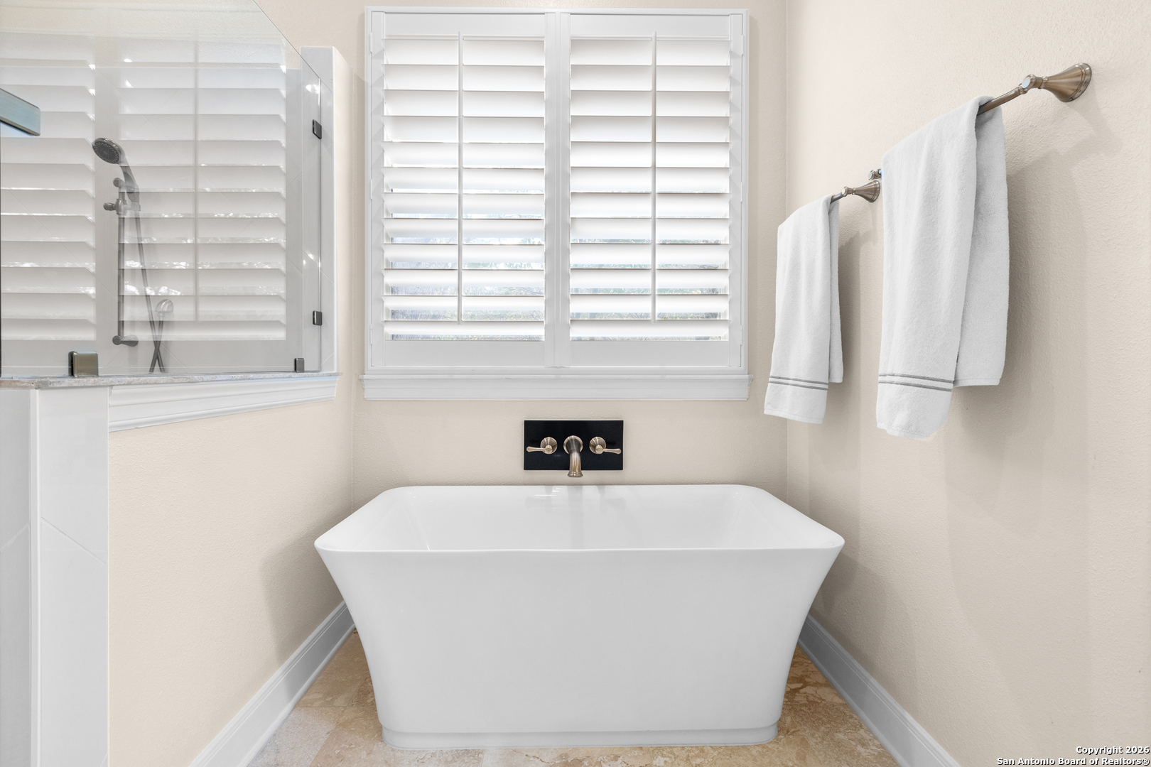 10924 Reyes Canyons Helotes, TX 78023 - Photo 39 of 61 a white bath tub sitting in a bathroom
