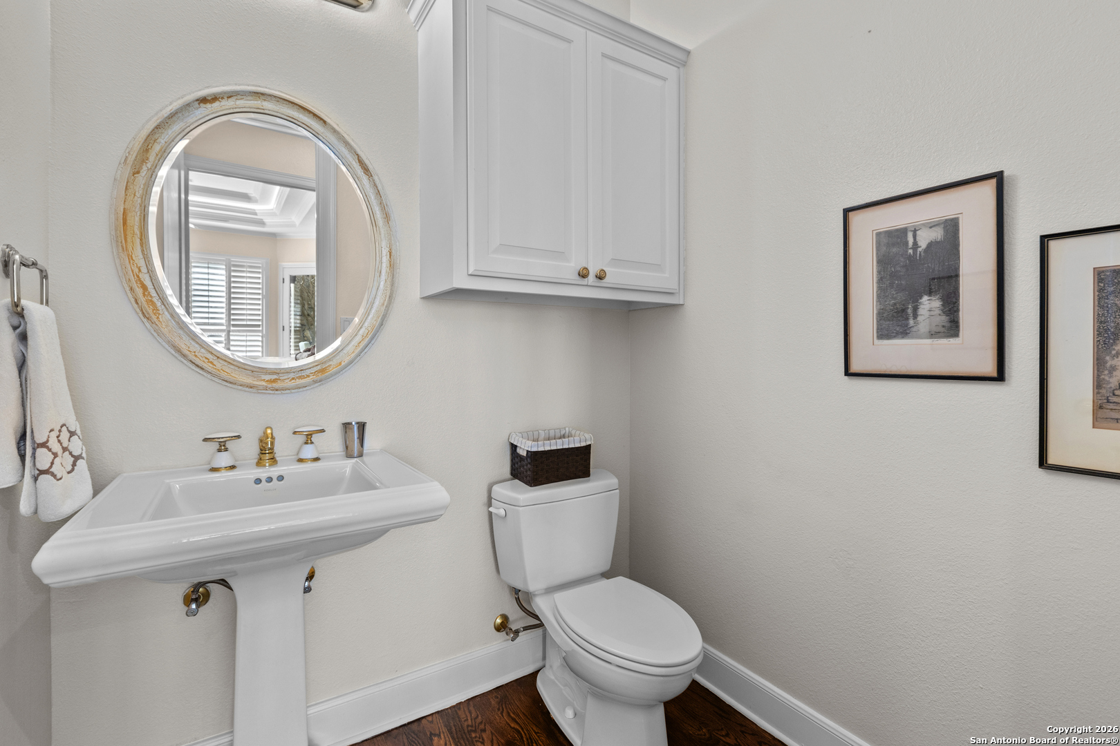10924 Reyes Canyons Helotes, TX 78023 - Photo 42 of 61 a bathroom with a toilet a sink and a mirror